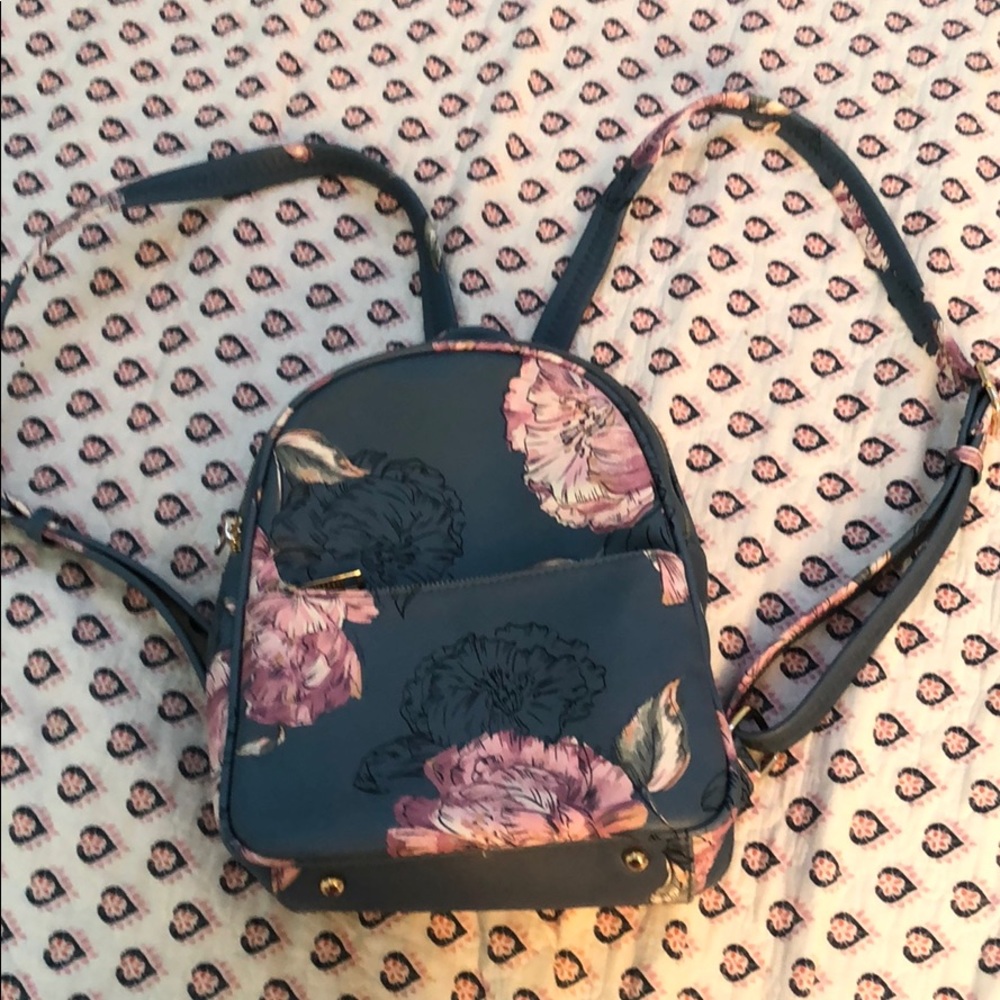 KAARI blue leather floral backpack